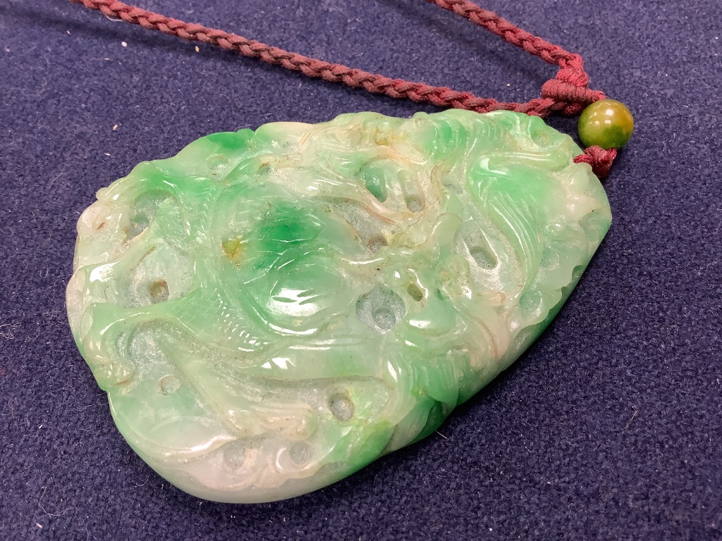 A Chinese jadeite pendant , a pair of bangles, earrings and a cricket pendant